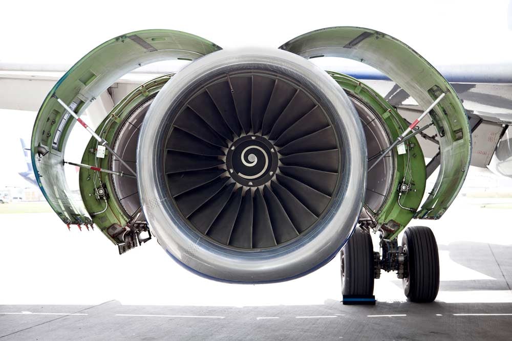 The next generation of aircraft engines installed on a parked airplane in the airport.