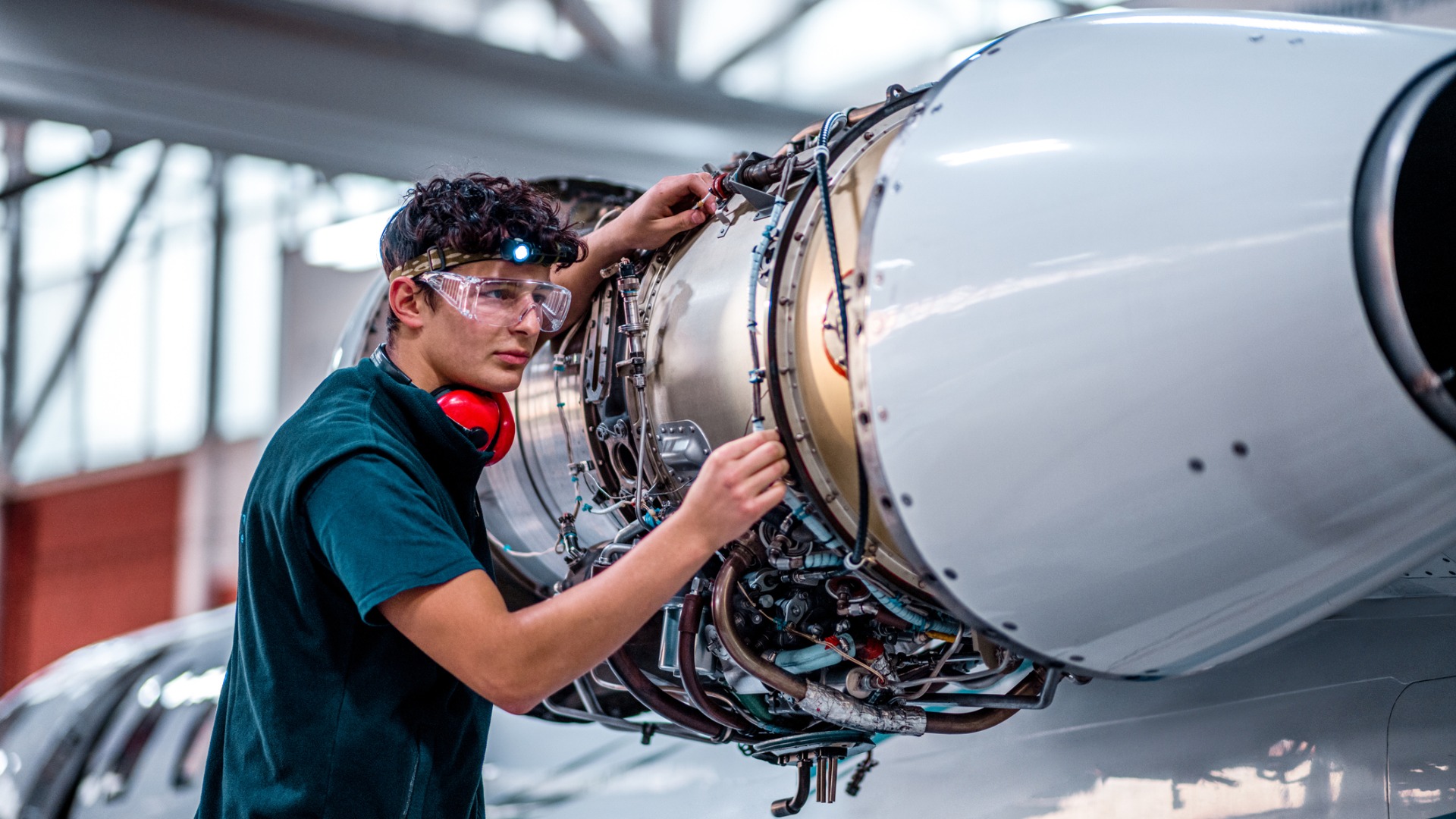 maintenance-mechanic-inspecting-the-jet-engine-picture-id1286754258
